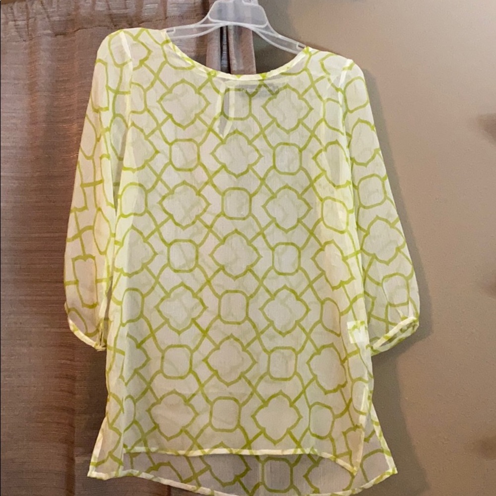 Women’s 3/4 sleeved, sheer top.